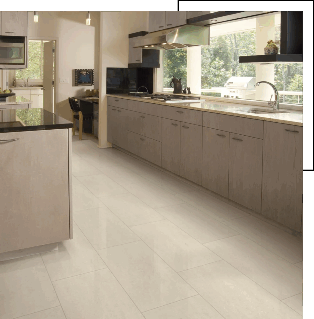 Modern kitchen with sleek cabinetry and large windows.