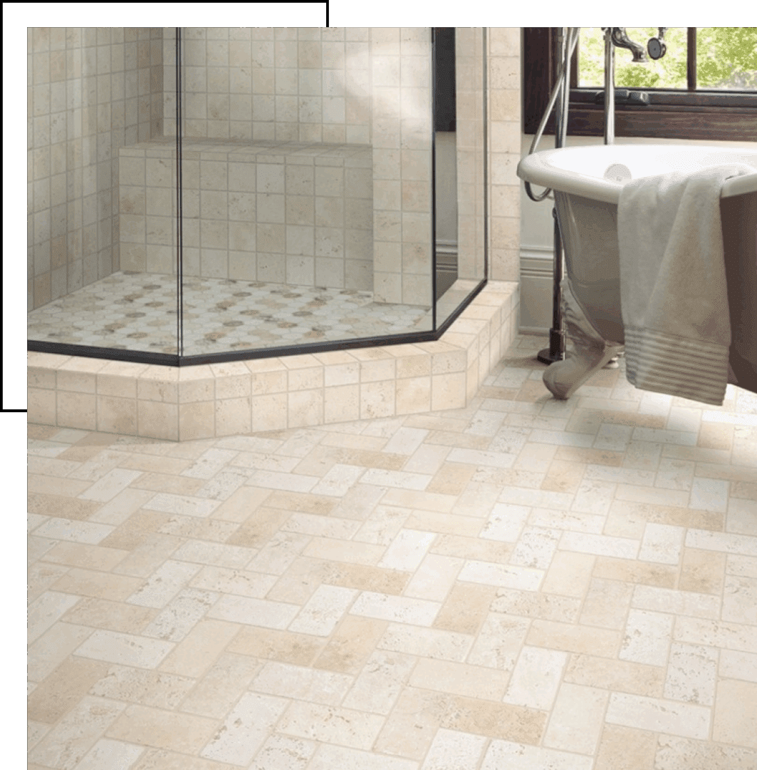 Elegant bathroom with beige tiled floor and glass shower enclosure.
