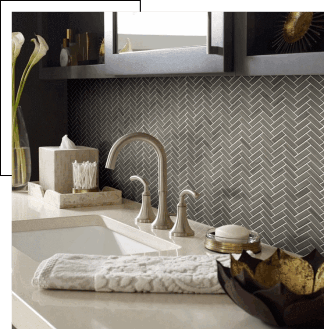 Elegant bathroom sink area with modern fixtures and decorative accents.