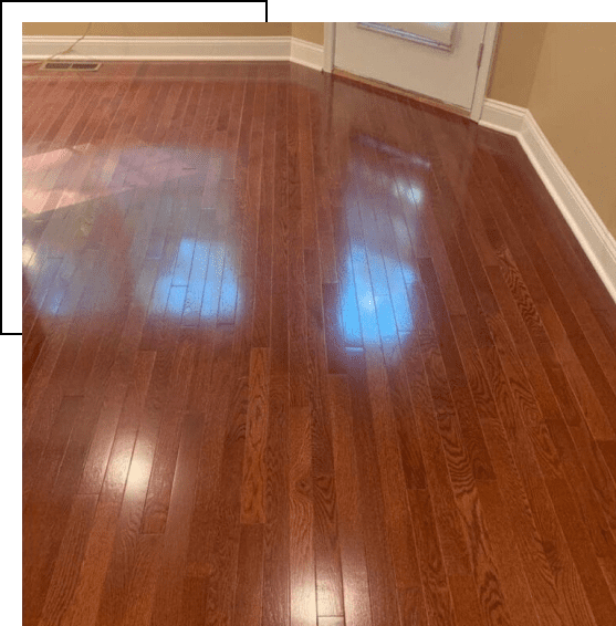 Shiny polished hardwood floor reflecting light.