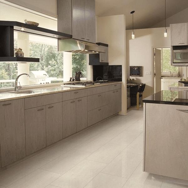 Modern kitchen with beige cabinets and large windows.
