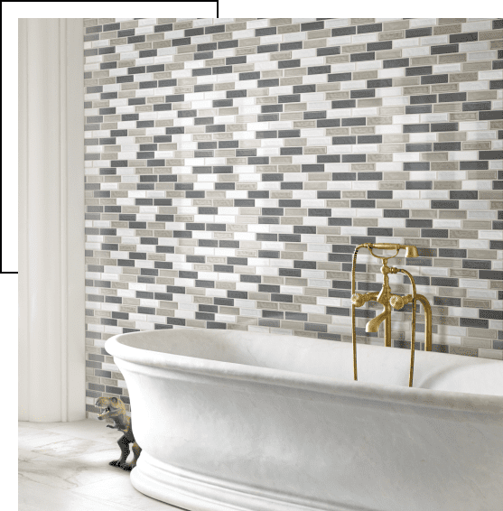 Elegant bathroom with a classic bathtub and mosaic tile wall.